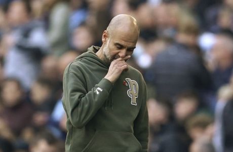 Manchester City's head coach Pep Guardiola gestures at the end of the English Premier League soccer match between Manchester City and Brentford, at the Etihad stadium in Manchester, England, Saturday, Nov.12, 2022. Brentford won 2-1.(AP Photo/Dave Thompson)