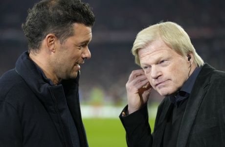 Former Bayern player Michael Ballack, left, talks to German soccer legend Oliver Kahn as they wait for the start of the Champions League quarter final second leg soccer match between Bayern Munich and Manchester City, at the Allianz Arena stadium in Munich, Germany, Wednesday, April 19, 2023. (AP Photo/Matthias Schrader)