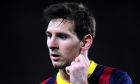FC Barcelona's Lionel Messi, from Argentina, gestures against Rayo Vallecano during a Spanish La Liga soccer match at the Camp Nou stadium in Barcelona, Spain, Saturday, Feb. 15, 2014. (AP Photo/Manu Fernandez)