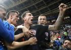 Croatia's Mario Mandzukic, center, celebrates after scoring his side's second goal during the semifinal match between Croatia and England at the 2018 soccer World Cup in the Luzhniki Stadium in Moscow, Russia, Wednesday, July 11, 2018. (AP Photo/Frank Augstein)