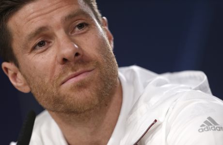 Bayern Munich's Xabi Alonso listens to a question during a news conference at the Santiago Bernabeu stadium in Madrid, Monday, April 17, 2017. Bayern Munich will play against Real Madrid a Champions League quarterfinal second leg soccer match on Tuesday 18. (AP Photo/Francisco Seco)