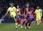 Barcelona's Sergio Busquets, left, duels for the ball with Athletico Madrid's Thomas Lemar during a Spanish La Liga soccer match between Atletico Madrid and FC Barcelona at the Metropolitano stadium in Madrid, Saturday, Nov. 24, 2018. (AP Photo/Manu Fernandez)