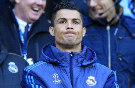Real Madrid's Cristiano Ronaldo watches the math at the bench during the Champions League semifinal soccer match between Manchester City and Real Madrid, at the City of Manchester stadium in Manchester, England, Tuesday, April 26, 2016. (AP Photo/Jon Super)