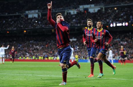 MADRID, SPAIN - MARCH 23:  Lionel Messi of Barcelona celebrates scoring his team's fourth goal during the La Liga match between Real Madrid CF and FC Barcelona at the Bernabeu on March 23, 2014 in Madrid, Spain.  (Photo by Denis Doyle/Getty Images)