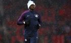 Manchester City's Eliaquim Mangala runs during warm up as snow falls before the English Premier League soccer match between Manchester United and Manchester City at Old Trafford Stadium in Manchester, England, Sunday, Dec. 10, 2017. (AP Photo/Dave Thompson)