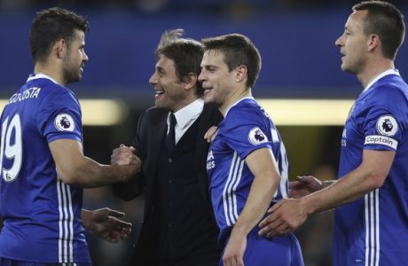 Chelsea's manager Antonio Conte congratulates Chelsea's Diego Costa, left, Cesar Azpilicueta, second right, and John Terry at the end of the English Premier League soccer match between Chelsea and Middlesbrough at Stamford Bridge stadium in London, Monday, May 8, 2017. Chelsea won the match 3-0. (AP Photo/Alastair Grant)