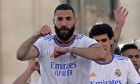 Real Madrid's Karim Benzema celebrates in Cibeles plaza after Real Madrid won the Spanish La Liga title by defeating Espanyol in Madrid, Spain, Saturday, April 30, 2022. (AP Photo/Paul White)