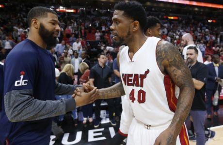 Miami Heat forward Udonis Haslem (40) and Washington Wizards forward Markieff Morris congratulate each other after the Heat defeated the Wizards 110-102 in an NBA basketball game Wednesday, April 12, 2017, in Miami. (AP Photo/Wilfredo Lee)