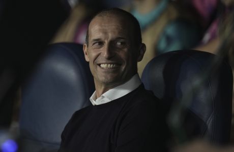 Juventus' head coach Massimiliano Allegri smiles during the group H Champions League soccer match between Maccabi Haifa and Juventus at Sammy Ofer stadium, in Haifa, Israel, Tuesday, Oct. 11, 2022. (AP Photo/Ariel Schalit)