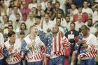 From left the USA's John Stockton, Chris Mullin, and Charles Barkley rejoice with their gold medals after beating Croatia, 117-85 in Olympics basketball in Barcelona Saturday, Aug. 8, 1992. The USA beat Croatia 117-85 to win the gold medal. (AP Photo/John Gaps III)