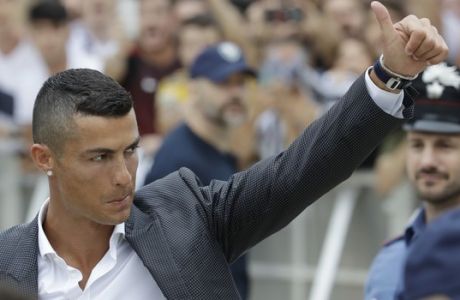 FILE - In this Monday, July 16, 2018 filer, Portuguese ace Ronaldo gives the thumb-up sign as he arrives to undergo medical checks at the Juventus stadium in Turin, Italy. Cristiano Ronaldo will likely make his Juventus debut at Chievo Verona as the Bianconeri kick off their attempt to win a record-extending eighth league title at the Stadio Bentegodi. The 2018-19 Serie A fixtures have been announced and the opening weekend also sees Napoli visit Lazio. The season starts on Aug. 18 and finishes May 26. (AP Photo/Luca Bruno, File)
