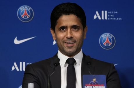 PSG president Nasser Al-Al-Khelaifi attends a press conference with Lionel Messi Wednesday, Aug. 11, 2021 at the Parc des Princes stadium in Paris. Lionel Messi is a "big asset" for Paris Saint-Germain from a commercial perspective, team president Nasser Al-Khelaifi said Wednesday. (AP Photo/Francois Mori)
