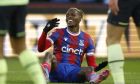 Crystal Palace's Wilfried Zaha reacts after missing a scoring chance during the English Premier League soccer match between Crystal Palace and Manchester City at Selhurst Park stadium, in London, Saturday, March 11, 2023. (AP Photo/David Cliff)