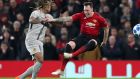 ManU defender Phil Jones, right, fights for the ball with Young Boys' Kevin Mbabu during the Champions League group H soccer match between Manchester United and Young Boys at Old Trafford Stadium in Manchester, England, Tuesday Nov. 27, 2018. (AP Photo/Jon Super)
