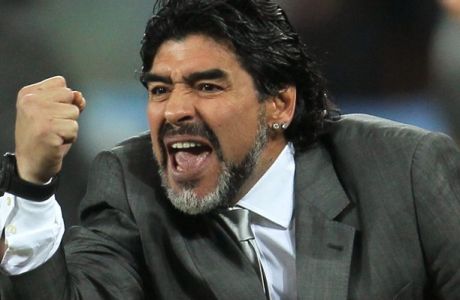 JOHANNESBURG, SOUTH AFRICA - JUNE 27:  Diego Maradona head coach of Argentina celebrates after  Gonzalo Higuain scores his side's second goal during the 2010 FIFA World Cup South Africa Round of Sixteen match between Argentina and Mexico at Soccer City Stadium on June 27, 2010 in Johannesburg, South Africa.  (Photo by Chris McGrath/Getty Images) *** Local Caption *** Diego Maradona
