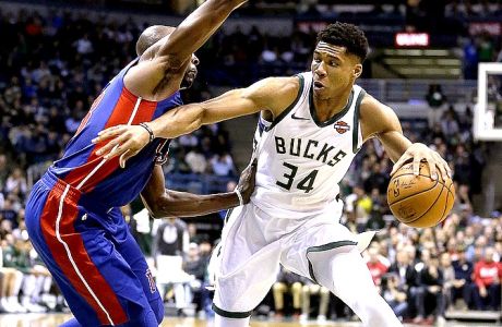 Milwaukee Bucks' Giannis Antetokounmpo (34) drives to the basket against Detroit Pistons' Anthony Tolliver during the second half of an NBA basketball game Wednesday, Nov. 15, 2017, in Milwaukee. The Bucks won 99-95. (AP Photo/Aaron Gash)