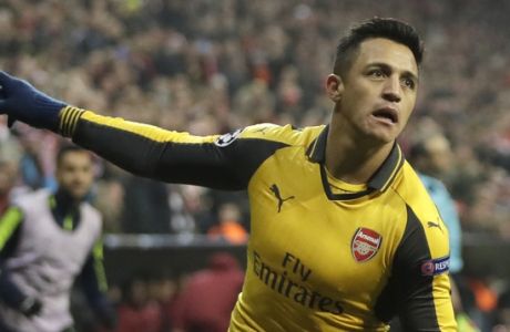 Arsenal's Alexis Sanchez celebrates after scoring his side's opening goal during the Champions League round of 16 first leg soccer match between FC Bayern Munich and Arsenal, in Munich, Germany, Wednesday, Feb. 15, 2017. (AP Photo/Matthias Schrader)