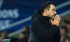 Barcelona's head coach Xavi Hernandez reacts during the Champions League Group H soccer match between Barcelona and Porto at the Olympic Stadium in Barcelona, Spain, Tuesday, Nov. 28, 2023. (AP Photo/Joan Monfort)
