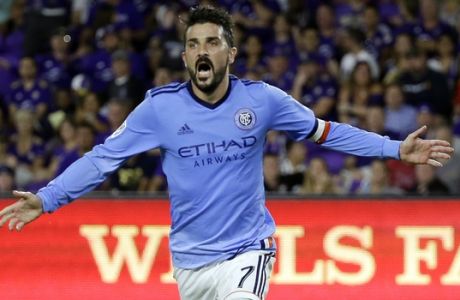 FILE - In this Sunday, May 21, 2017 file photo, New York City FC's David Villa (7) celebrates his second-half goal as he runs past Orlando City's Leo Pereira, left, in an MLS soccer game in Orlando, Fla. (AP Photo/John Raoux, File)