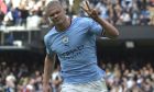 Manchester City's Erling Haaland celebrates after scoring his side's second goal during the English Premier League soccer match between Manchester City and Brighton and Hove Albion at Etihad stadium in Manchester, England, Saturday, Oct. 22, 2022. (AP Photo/Rui Vieira)