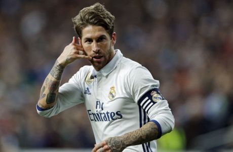 Real Madrid's Sergio Ramos gestures after scoring his side's second goal against Real Betis during a Spanish La Liga soccer match between Real Madrid and Real Betis at the Santiago Bernabeu stadium in Madrid, Sunday, March 12, 2017. Ramos scored the winning goal in Real Madrid's 2-1 victory. (AP Photo/Francisco Seco)