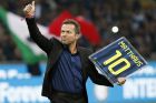Former soccer star Lothar Matthaus waves Inter Milan's supporters prior to the start of the Serie A soccer match between Inter Milan and Napoli at the San Siro stadium in Milan, Italy, Sunday, April 30, 2017. (AP Photo/Antonio Calanni)