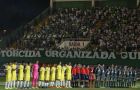 Players of Colombia's Atletico Nacional, left, and Brazil's Chapecoense, stand to listen the Brazilian national anthem, prior to their Recopa Sudamericana first leg final soccer match in Chapeco, Brazil, Tuesday, April 4, 2017. (AP Photo/Andre Penner)