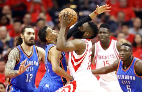 Houston Rockets' James Harden (13) drives toward the basket as Oklahoma City Thunder's Andre Roberson, second from left, defends during the first half in Game 5 of an NBA basketball first-round playoff series, Tuesday, April 25, 2017, in Houston. (AP Photo/David J. Phillip)