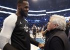 CORRECTS TO THE LAKERS, NOT THE CAVALIERS - Team LeBron's LeBron James, of the Los Angeles Lakers, left, speaks with New England Patriots Owner Robert Kraft during the second half of an NBA All-Star basketball game, Sunday, Feb. 17, 2019, in Charlotte, N.C. (AP Photo/Chuck Burton)