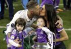 Real Madrid's Sergio Ramos celebrates with his family after winning the Champions League Final soccer match between Juventus and Real Madrid at the Millennium Stadium in Cardiff, Wales, Saturday, June 3, 2017. (Nick Potts/PA via AP)