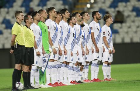 Greece's national team line up for national anthem during the World Cup 2022 group I qualifying soccer match between Kosovo and Greece at the Fadil Vokrri stadium in Pristina, Kosovo on Sunday, Sep 5, 2021. (AP Photo/Visar Kryeziu)
