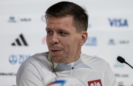 Poland's goalkeeper Wojciech Szczesny attends a press conference at the Qatar National Convention Center on the eve of the group C World Cup soccer match between Mexico and Poland, in Doha, Qatar, Monday, Nov. 21, 2022. (AP Photo/Moises Castillo)