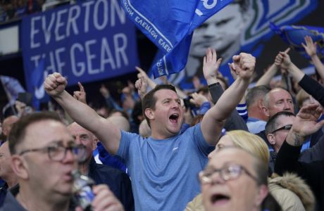 Everton fans shout slogans during the English Premier League soccer match between Everton and Crystal Palace at Goodison Park in Liverpool, England, Thursday, May 19, 2022. (AP Photo/Jon Super)