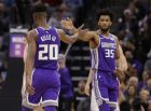 Sacramento Kings' forward Marvin Bagley III, right, receives congratulations from teammate Harry Giles III, left, after scoring against the Portland Trail Blazers during the second half of an NBA basketball game, Monday, Jan. 14, 2019, in Sacramento, Calif. The Kings won 115-107. (AP Photo/Rich Pedroncelli)