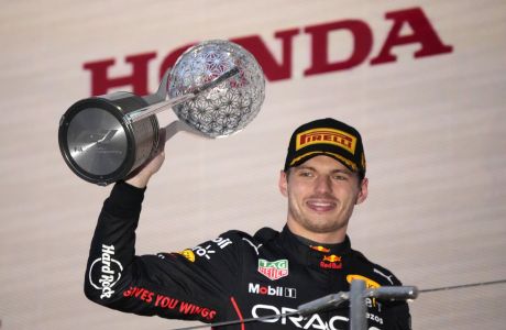 Red Bull driver Max Verstappen of the Netherlands celebrates his win during the Japanese Formula One Grand Prix at the Suzuka Circuit in Suzuka, central Japan, Sunday, Oct. 9, 2022. Verstappen secured second consecutive Formula One drivers' championship. (AP Photo/Eugene Hoshiko)