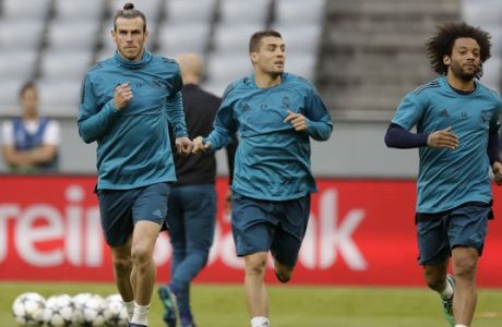 Real Madrid's Gareth Bale, from left, Mateo Kovacic and Marcelo warm up during a training session in Munich, Germany, Tuesday, April 24, 2018. FC Bayern Munich will face Real Madrid for a Champions League semi final first leg soccer match in Munich on Wednesday, April 25, 2018. (AP Photo/Matthias Schrader)
