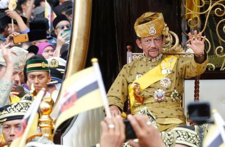 epa07475105 (FILE) Brunei's Sultan Hassanal Bolkiah waves to well-wishers during a procession as part of the Golden Jubilee celebrations in Bandar Seri Begawan, Brunei, 05 October 2017 (reissued 21 March 2019). Brunei will move towards the full implementation of Sharia law on 03 April 2019.  EPA/STRINGER   BRUNEI OUT