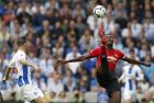 Manchester United's Paul Pogba, right, is challenged by Brighton's Pascal Gross during the English Premier League soccer match between Brighton and Hove Albion and Manchester United at the Amex stadium in Brighton, England, Sunday, Aug. 19, 2018. (AP Photo/Alastair Grant)