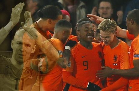 Netherland's Virgil Van Dijk is celebrated by his team after scoring his side's second goal in the 90th minute during the UEFA Nations League soccer match between Germany and The Netherlands in Gelsenkirchen, Monday, Nov. 19, 2018. The match ended 2-2. (AP Photo/Martin Meissner)