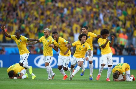 BELO HORIZONTE, BRAZIL - JUNE 28:  Brazil celebrate after defeating Chile in a penalty shootout during the 2014 FIFA World Cup Brazil round of 16 match between Brazil and Chile at Estadio Mineirao on June 28, 2014 in Belo Horizonte, Brazil.  (Photo by Paul Gilham/Getty Images)