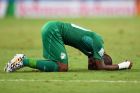FORTALEZA, BRAZIL - JUNE 24:  A dejected Die Serey of the Ivory Coast lies on the field after being defeated by Greece 2-1 during the 2014 FIFA World Cup Brazil Group C match between Greece and the Ivory Coast at Castelao on June 24, 2014 in Fortaleza, Brazil.  (Photo by Laurence Griffiths/Getty Images)