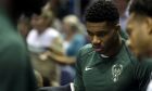 Milwaukee Bucks' Giannis Antetokounmpo is seen on the sidelines during a preseason NBA basketball game against the Indiana Pacers Wednesday, Oct. 4, 2017, in Milwaukee. (AP Photo/Aaron Gash)