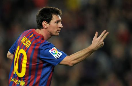 FC Barcelona's Argentinian forward Lionel Messi celebrates after scoring a goal during their Spanish League football match between FC Barcelona and Mallorca FC on October 29, 2011 at Camp Nou stadium in Barcelona. AFP PHOTO/LLUIS GENE (Photo credit should read LLUIS GENE/AFP/Getty Images)