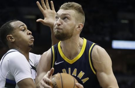 RETRANSMISSION TO CORRECT ID TO JOHN HENSON - Indiana Pacers' Domantas Sabonis, right, tries to drive past Milwaukee Bucks' John Henson during the first half of an NBA basketball game Wednesday, Jan. 3, 2018, in Milwaukee. (AP Photo/Morry Gash)