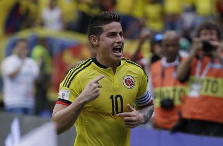 Colombia's James Rodriguez celebrates scoring his side's first goal against Bolivia during a 2018 World Cup qualifying soccer match at the Roberto Melendez stadium in Barranquilla, Colombia, Thursday, March 23, 2017. (AP Photo/Ricardo Mazalan)