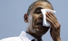 President Barack Obama wipes sweat from his face during a campaign event at Iowa State University, Tuesday, Aug. 28, 2012, in Ames, Iowa. (AP Photo/Pablo Martinez Monsivais)