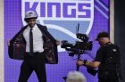 Kentucky's De' Aaron Fox reacts after being selected by the Sacramento Kings as the fifth pick overall during the NBA basketball draft, Thursday, June 22, 2017, in New York. (AP Photo/Frank Franklin II)