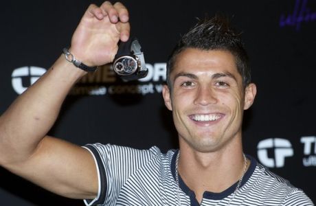 Cristiano Ronaldo 
attends a photocall to promote 'Time Force' watches at Puerta de America Hotel in Madrid.
Madrid, Spain - 08.09.10
***No Spanish Sales, Available For The Rest Of The World***
Mandatory Credit: Sean Thorton/WENN.COM