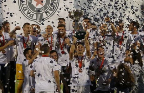 Partizan players celebrate after winning Serbia's national Cup final soccer match against Red Star, in Belgrade, Serbia, Saturday, May 27, 2017. Partizan won 1-0. (AP Photo/Darko Vojinovic)