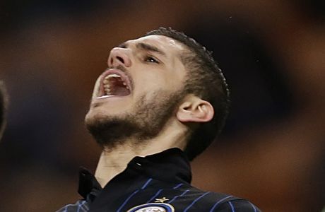 FILE - In this file photo dated Sunday, March 15, 2015, Inter Milan's Mauro Icardi, reacts after missing a chance to score during a Serie A soccer match against Cesena, at the San Siro stadium in Milan, Italy.  Prolific striker Mauro Icardis arrival at French champion Paris Saint-Germain impressed with 20 goals in 31 games when the league season was stopped because of the coronavirus pandemic. (AP Photo/Luca Bruno, FILE)